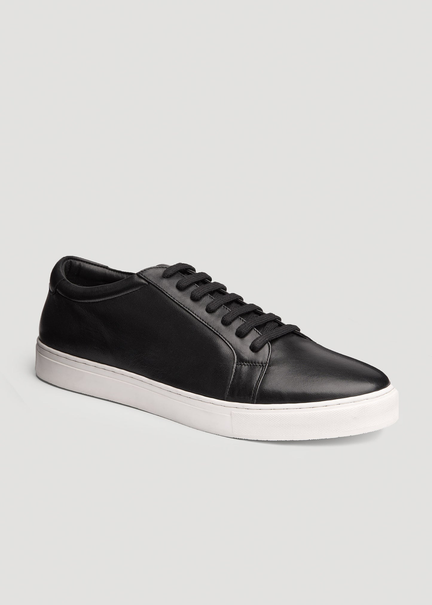 Side view of American Tall's Cupsole Tennis Sneakers for Tall Men in Black.