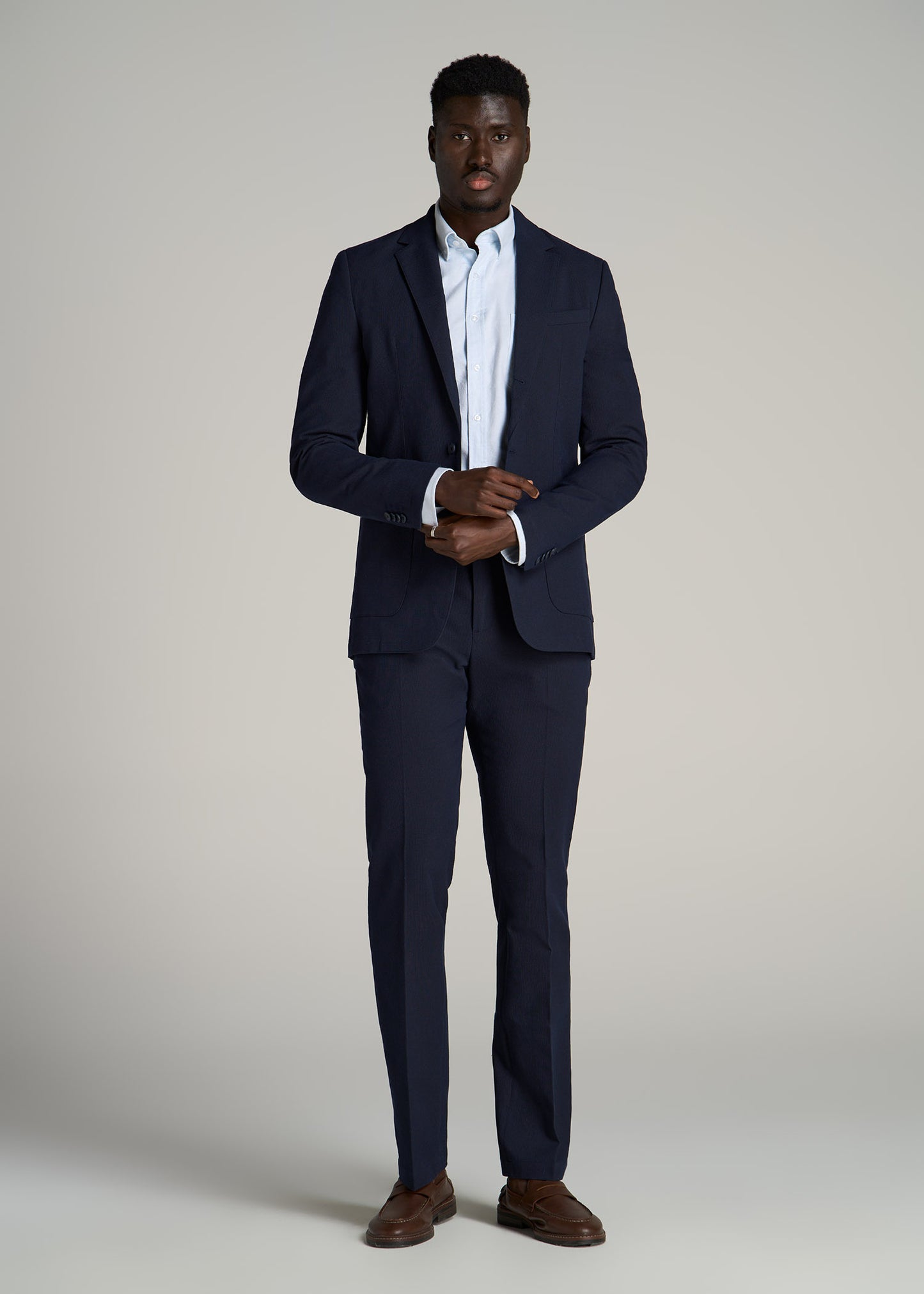 A tall man wearing Garment Washed Stretch Chino Tall Blazer in Evening Blue from American Tall