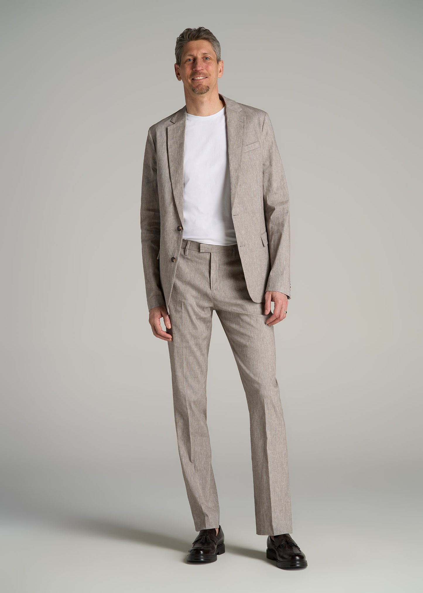 A tall man wearing Stretch Linen Blazer for Tall Men in Brown Linen from American Tall