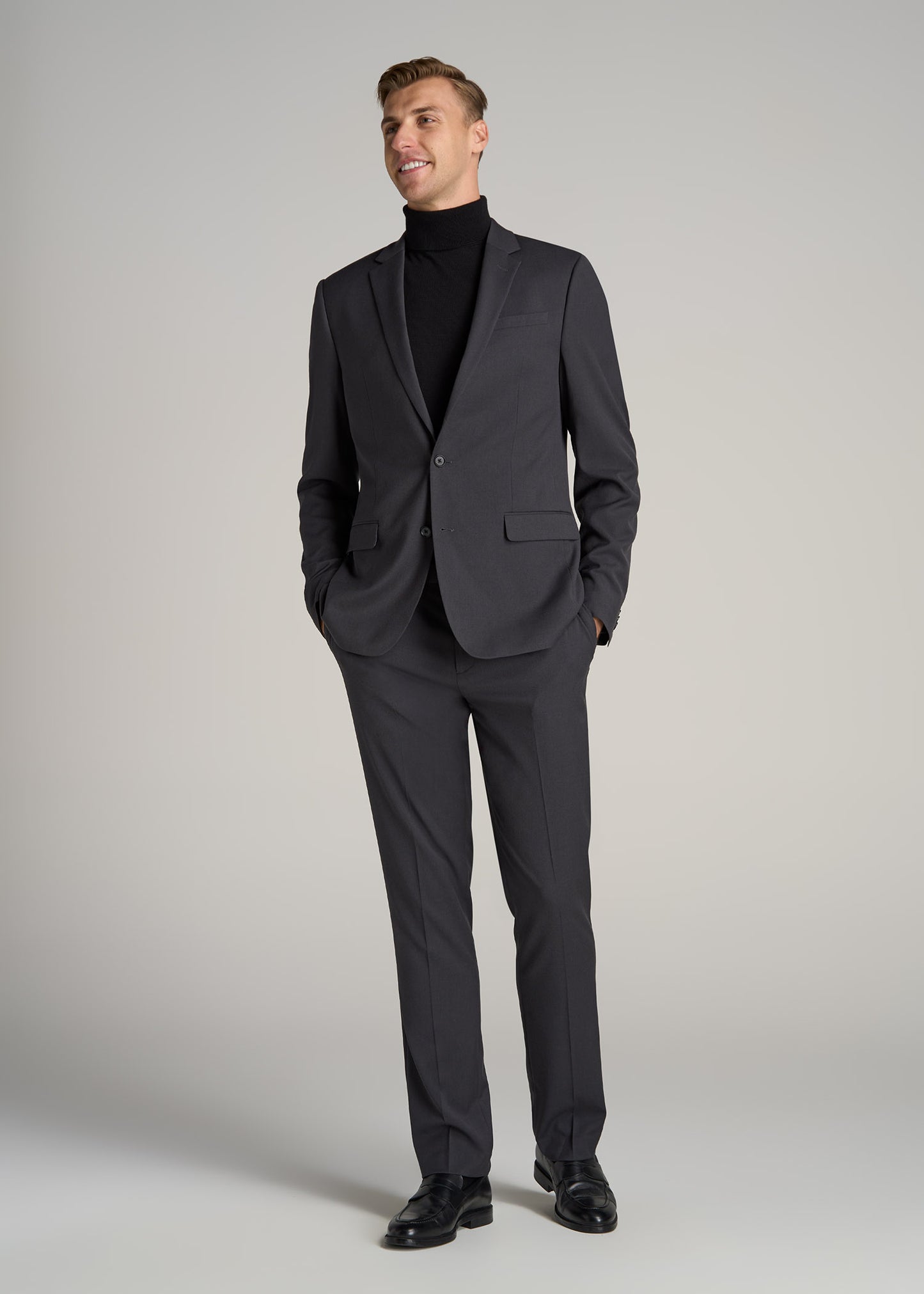 A tall man wearing Suit Jacket for Tall Men in Mid Grey from American Tall