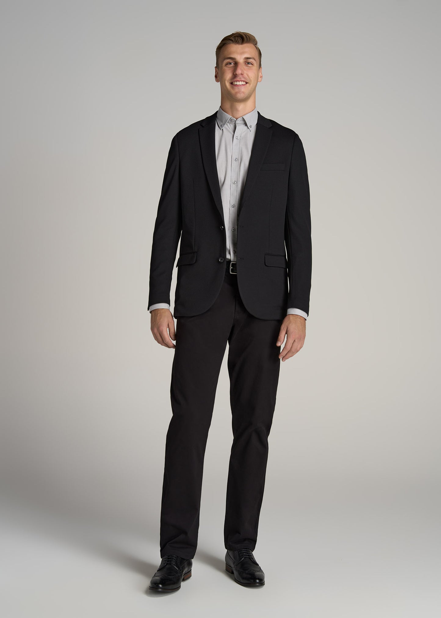 A tall man wearing Textured Blazer for Tall Men in Black from American Tall