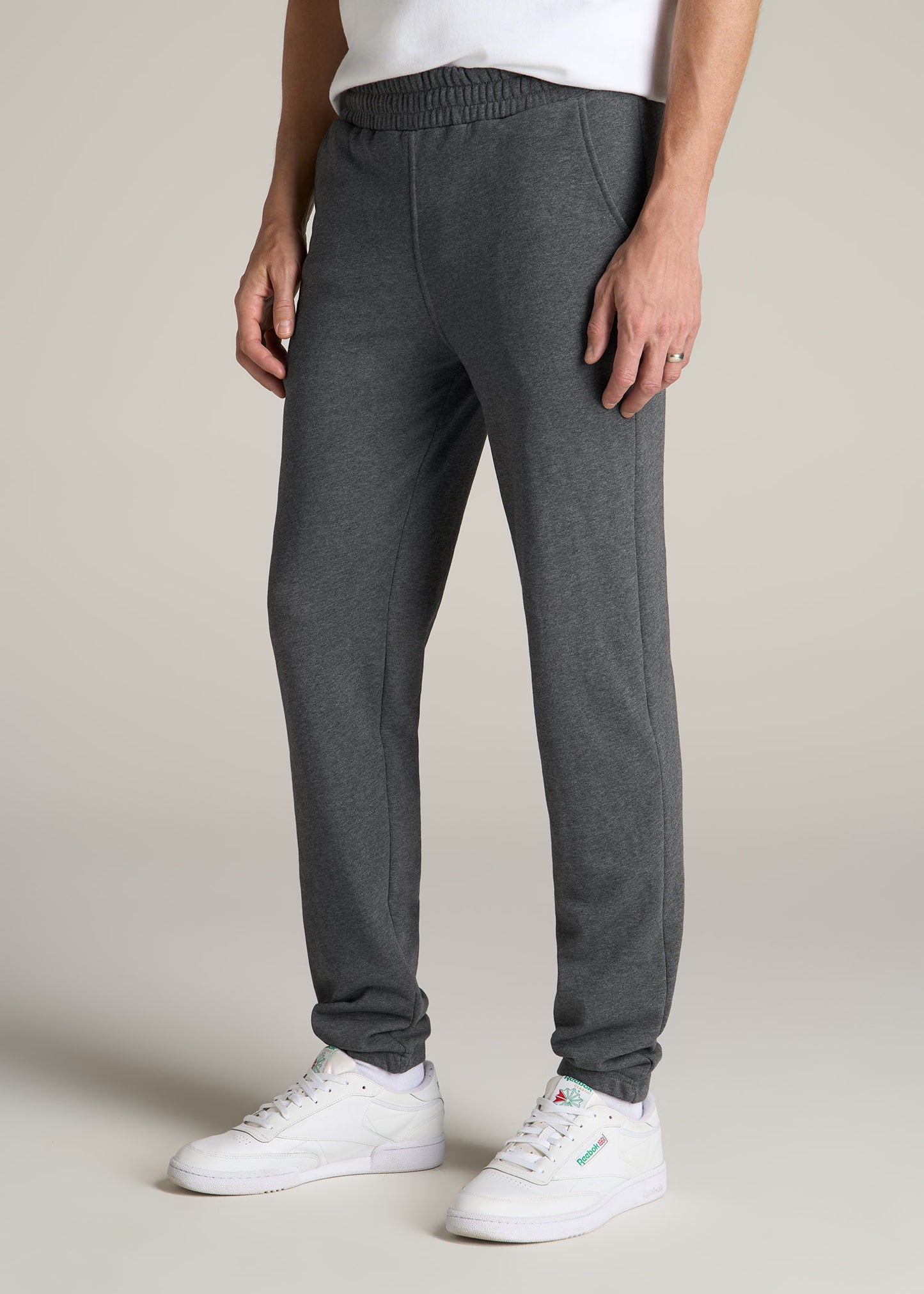 A tall man wearing American Tall's Wearever French Terry Sweatpants for Tall Men in Charcoal Mix