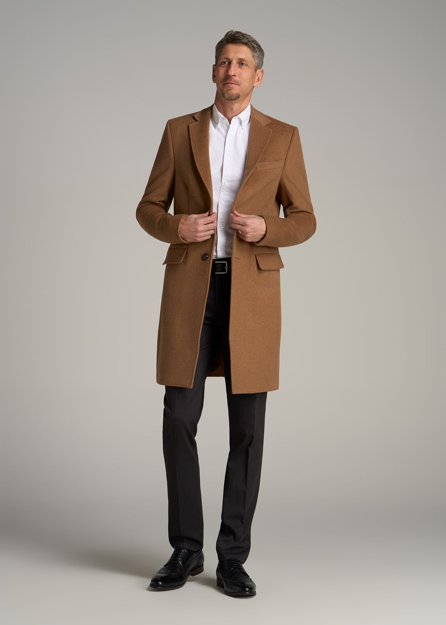 A tall man wearing American Tall's Wool Coat for Tall Men in Camel.