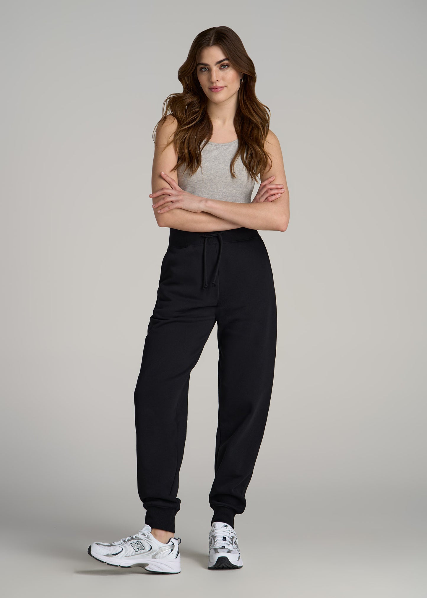 A tall woman wearing A.T. Basics Athletic Joggers for Tall Women in Black from American Tall