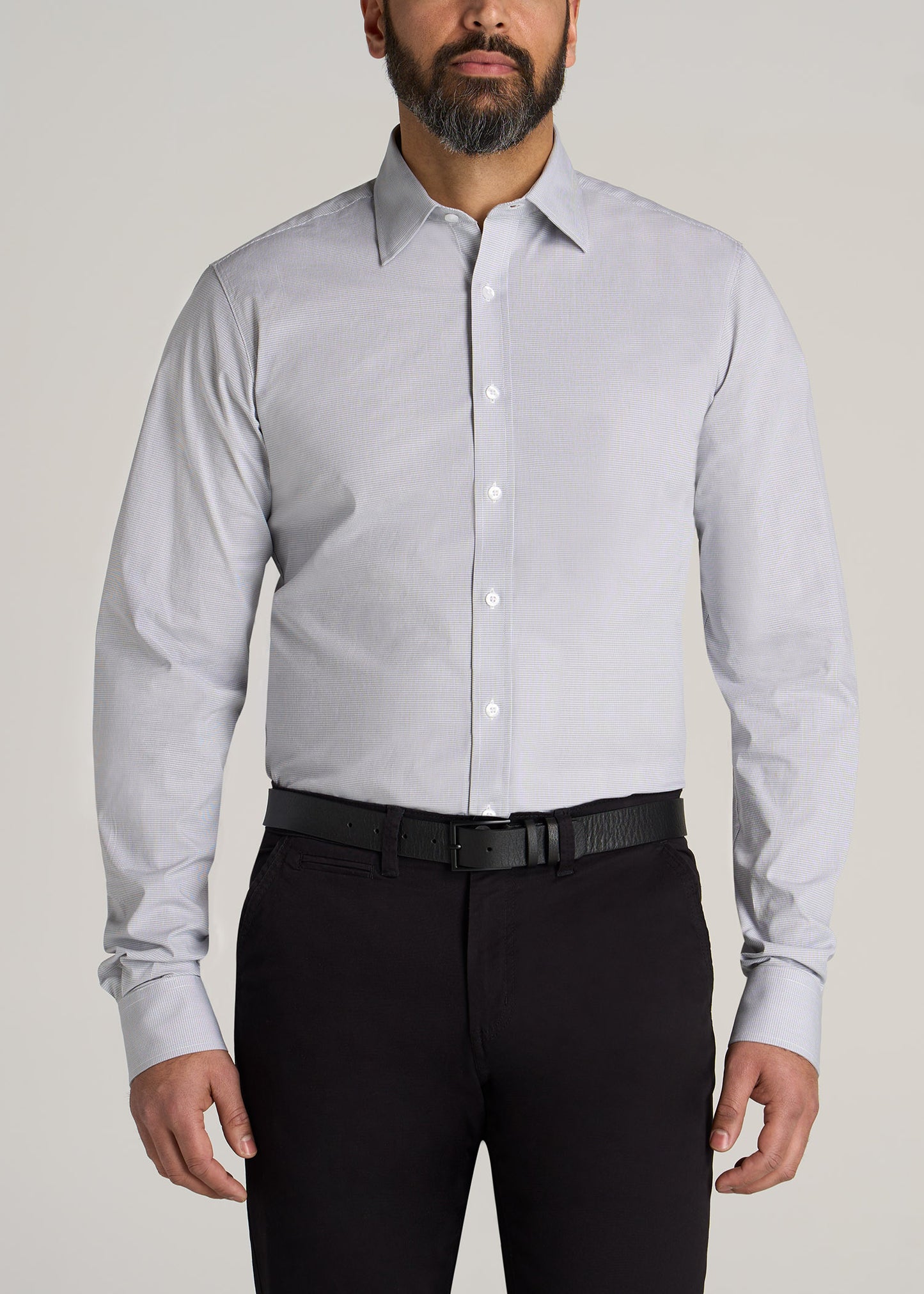 A tall man wearing American Tall's Oskar Button-Up Shirt for Tall Men in Grey & White Gingham.
