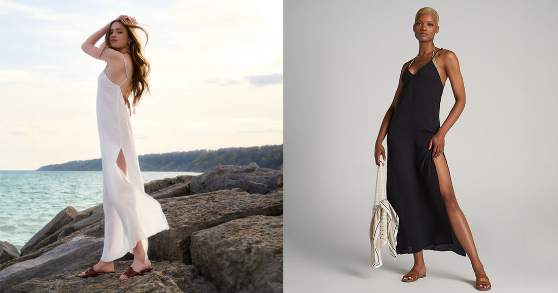 Two tall women wearing long maxi dresses - one in white at the beach, and one in black carrying a bag