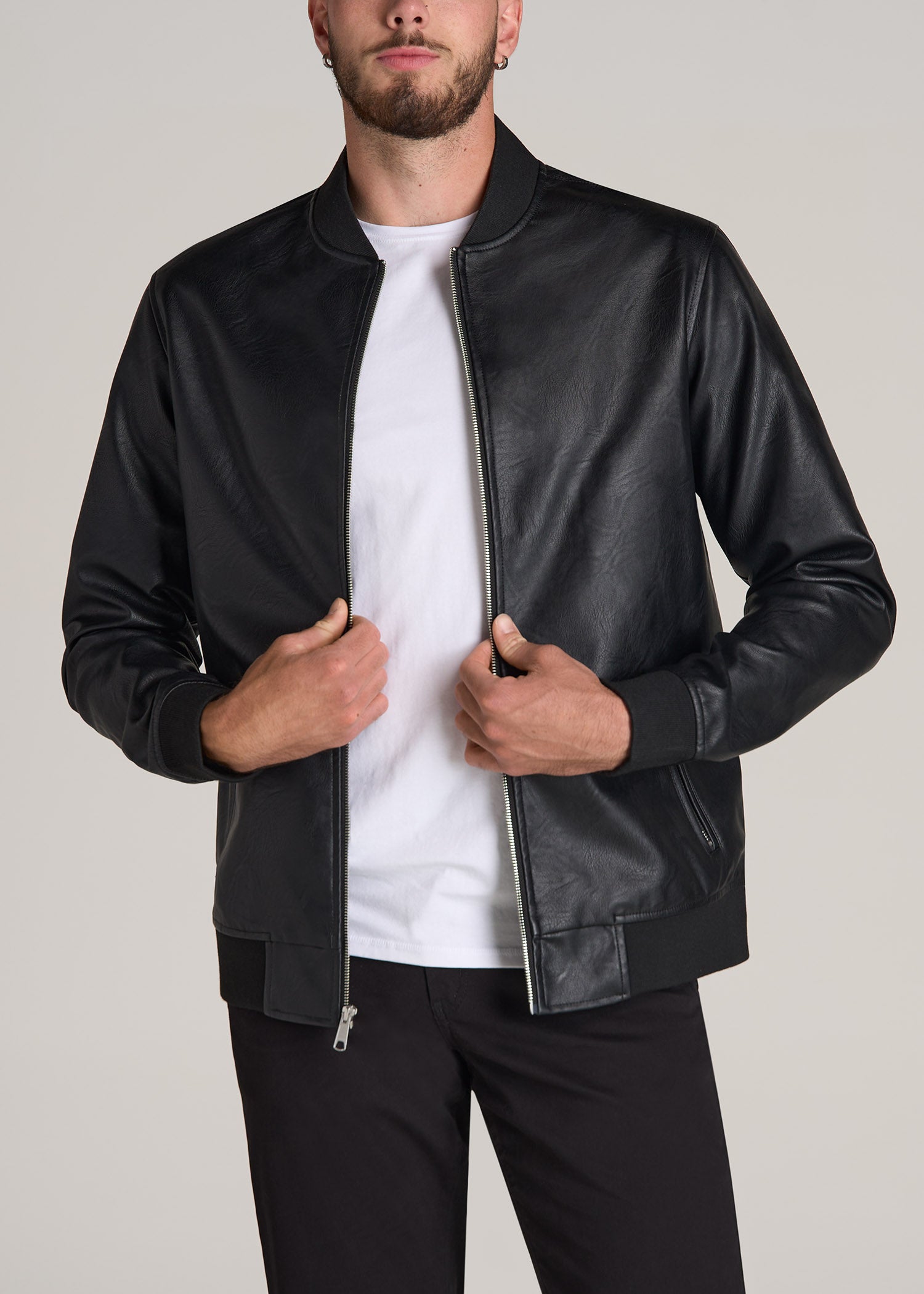 Tall man wearing American Tall's Faux Leather Bomber Jacket for Tall Men in Black.