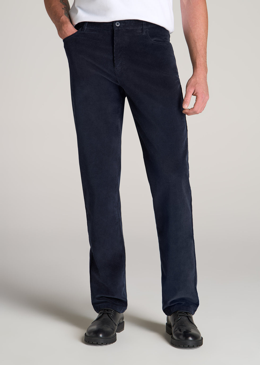 Tall man wearing American Tall's J1 Stretch Corduroy in Evening Blue