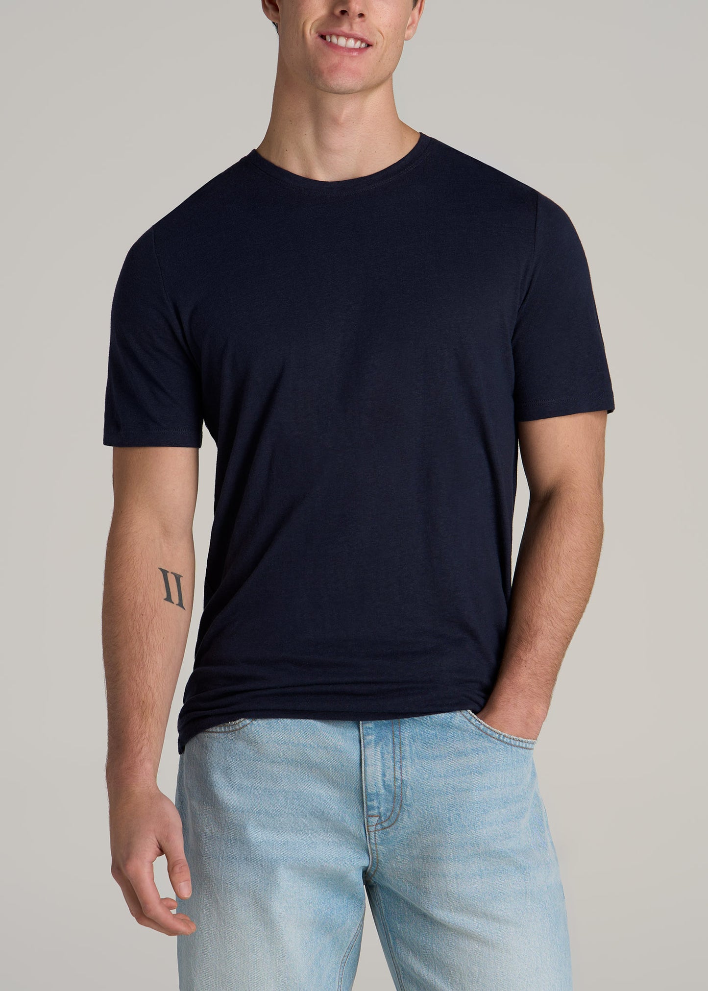 A tall man wearing American Tall's Linen Crewneck T-Shirt for Tall Men in Evening Blue.