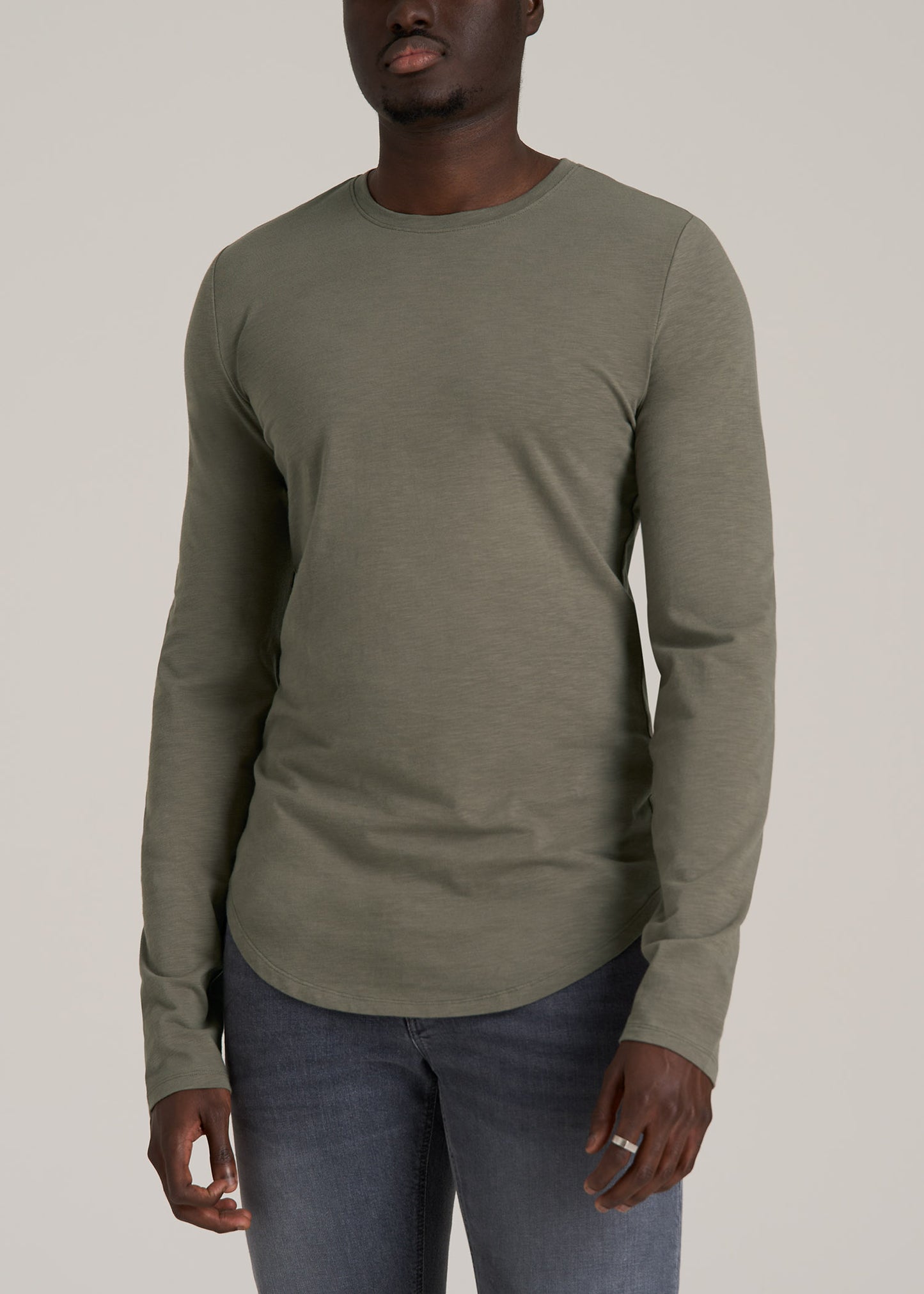 A tall man wearing American Tall's Slub Long Sleeve Scoop Tall Men's Tee in Camper Green