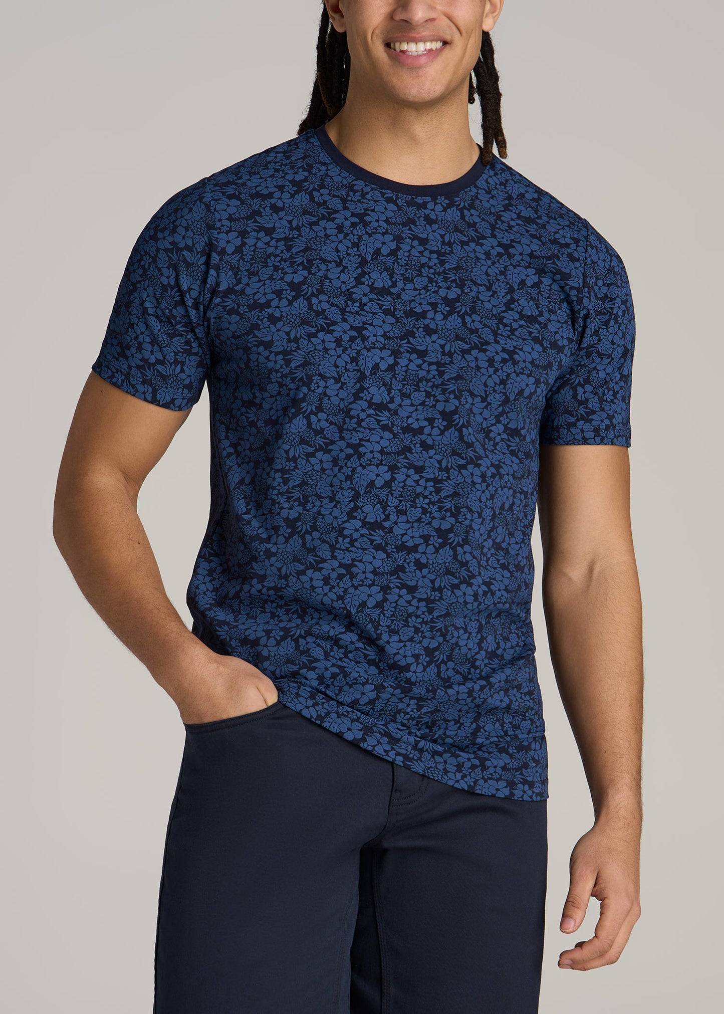 A tall man wearing American Tall's Stretch Pima Cotton Printed Tee for Tall Men in Blue Hibiscus.