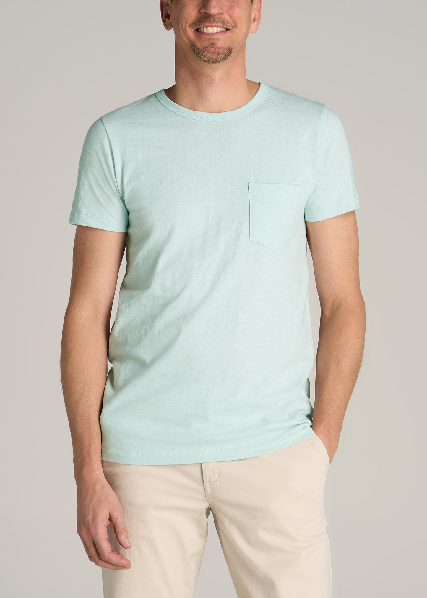 A tall man wearing American Tall's Sunwashed Slub Pocket T-Shirt For Tall Men in Mint.