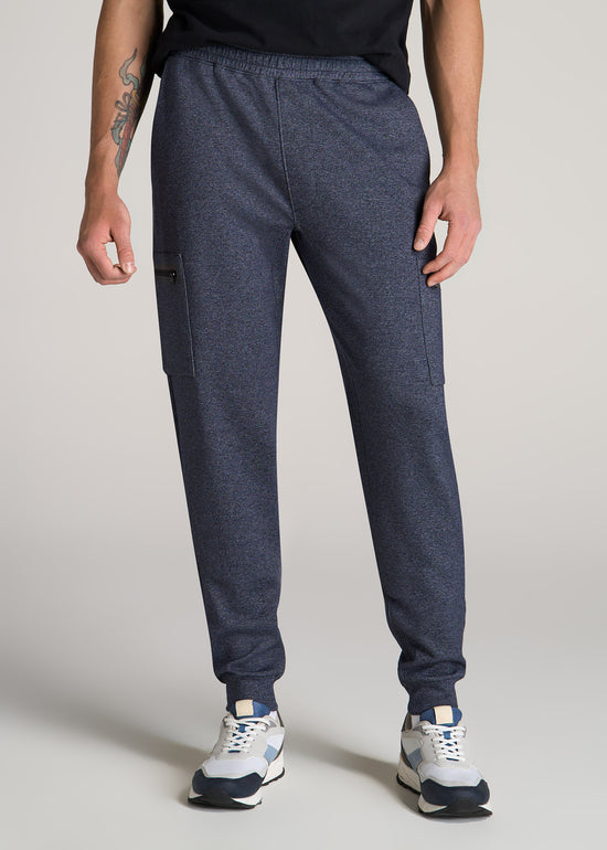 Tall man wearing American Tall's Utility Cargo Joggers in the color Evening Blue Mix.