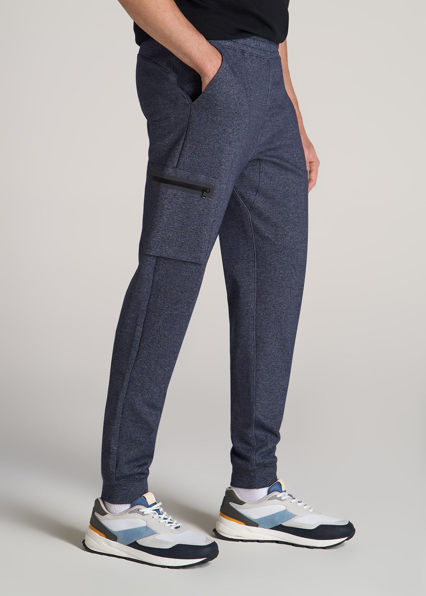 Semi-tall man wearing American Tall's Utility Cargo Joggers in the color Evening Blue Mix.