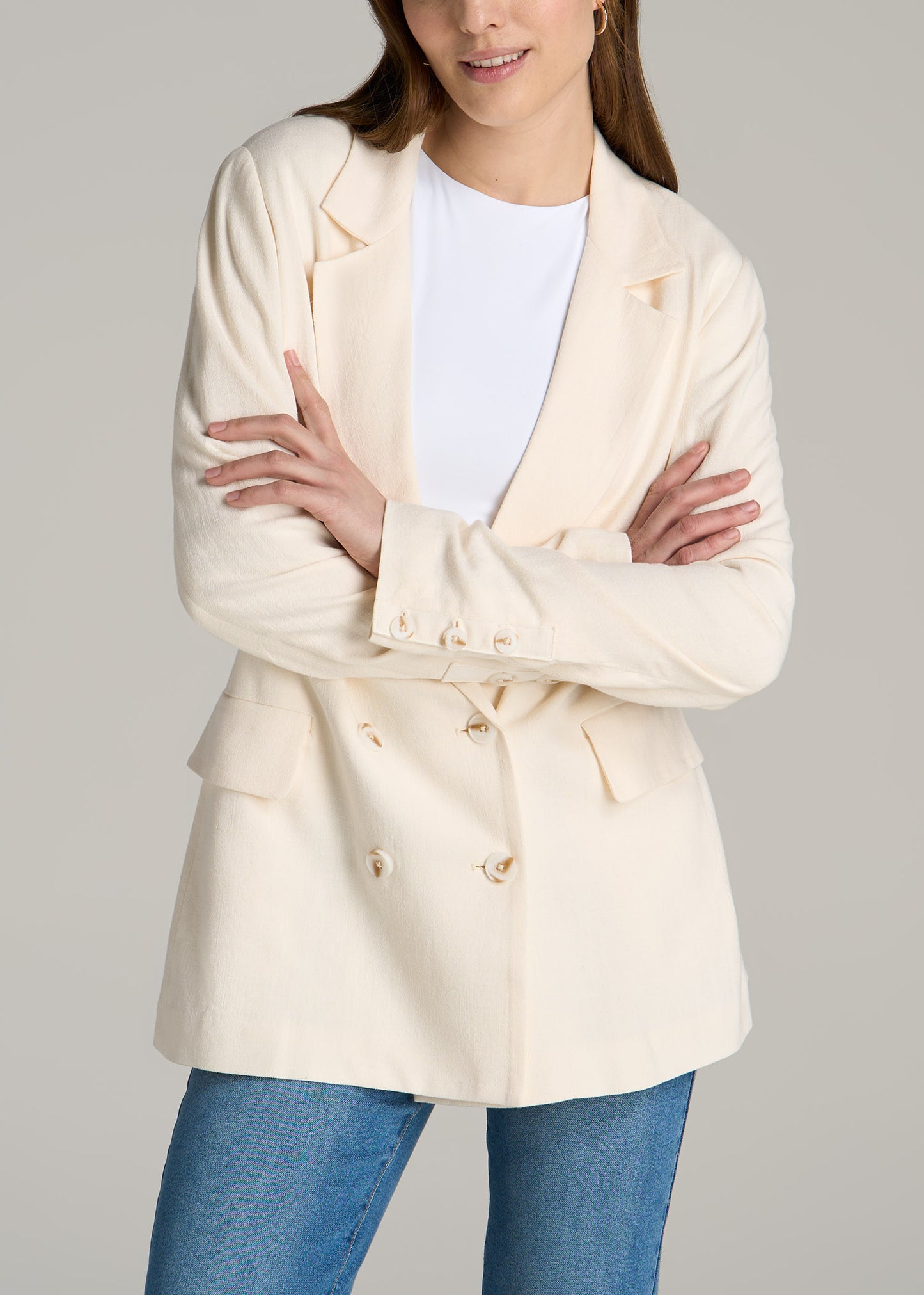 A tall woman wearing American Tall's Linen Blend Tie Back Blazer For Tall Women in the color White Alyssum.