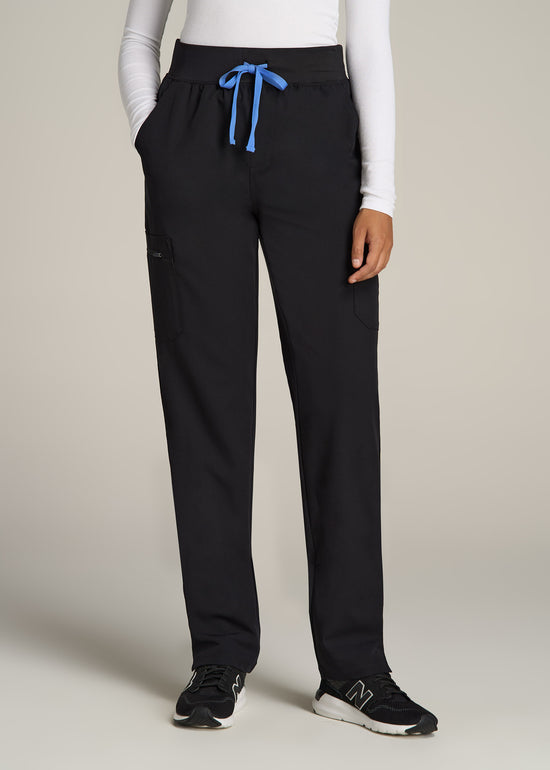 A tall woman wearing American Tall's Cargo Scrub Pants in the color Black.
