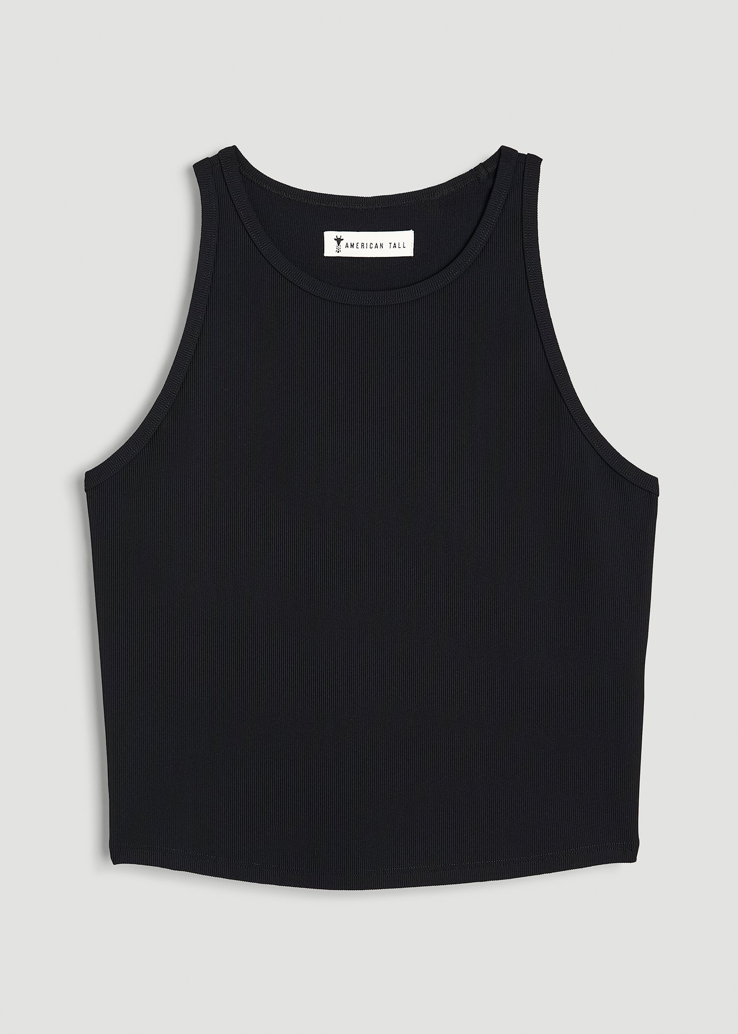 A tall woman wearing American Tall's Cropped Ribbed Tank Top for Tall Women