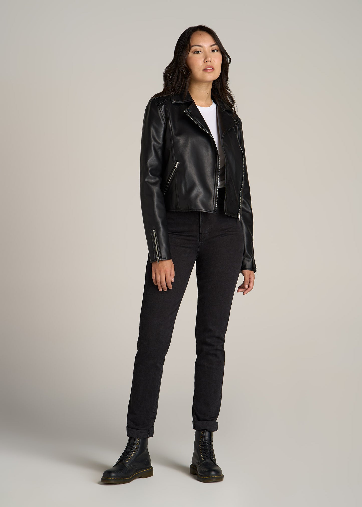 A tall woman wearing American Tall's Faux Leather Moto Jacket in the color Black.
