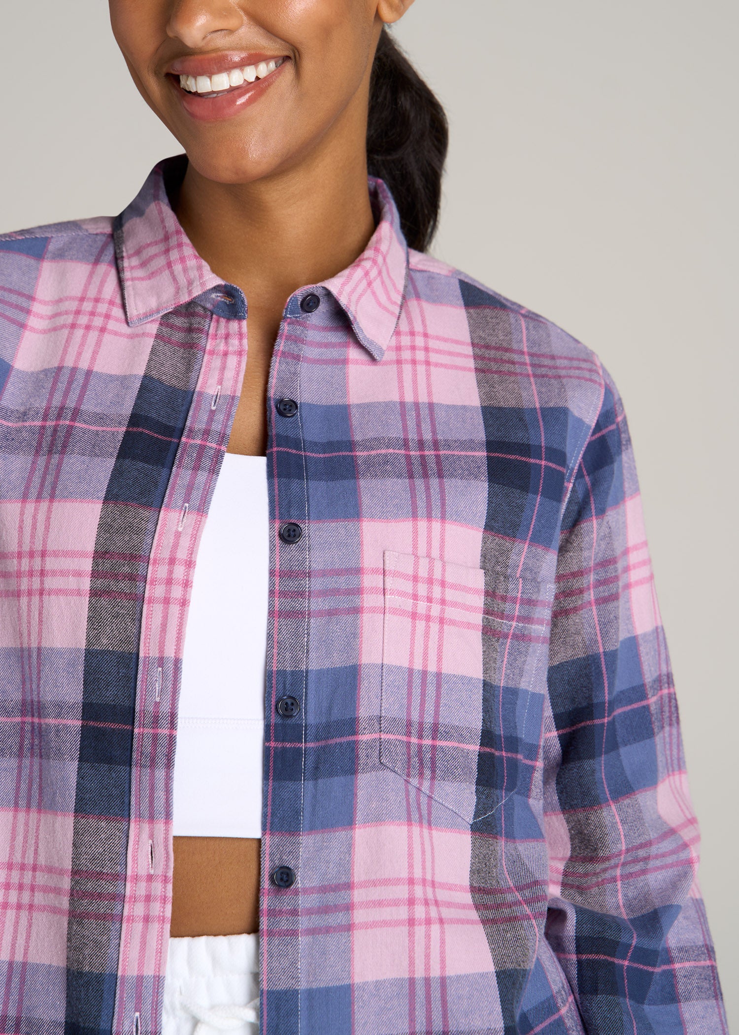 Tall woman wearing American Tall's Flannel Button-Up Shirt for Tall Women in Mauve and Blue Plaid.