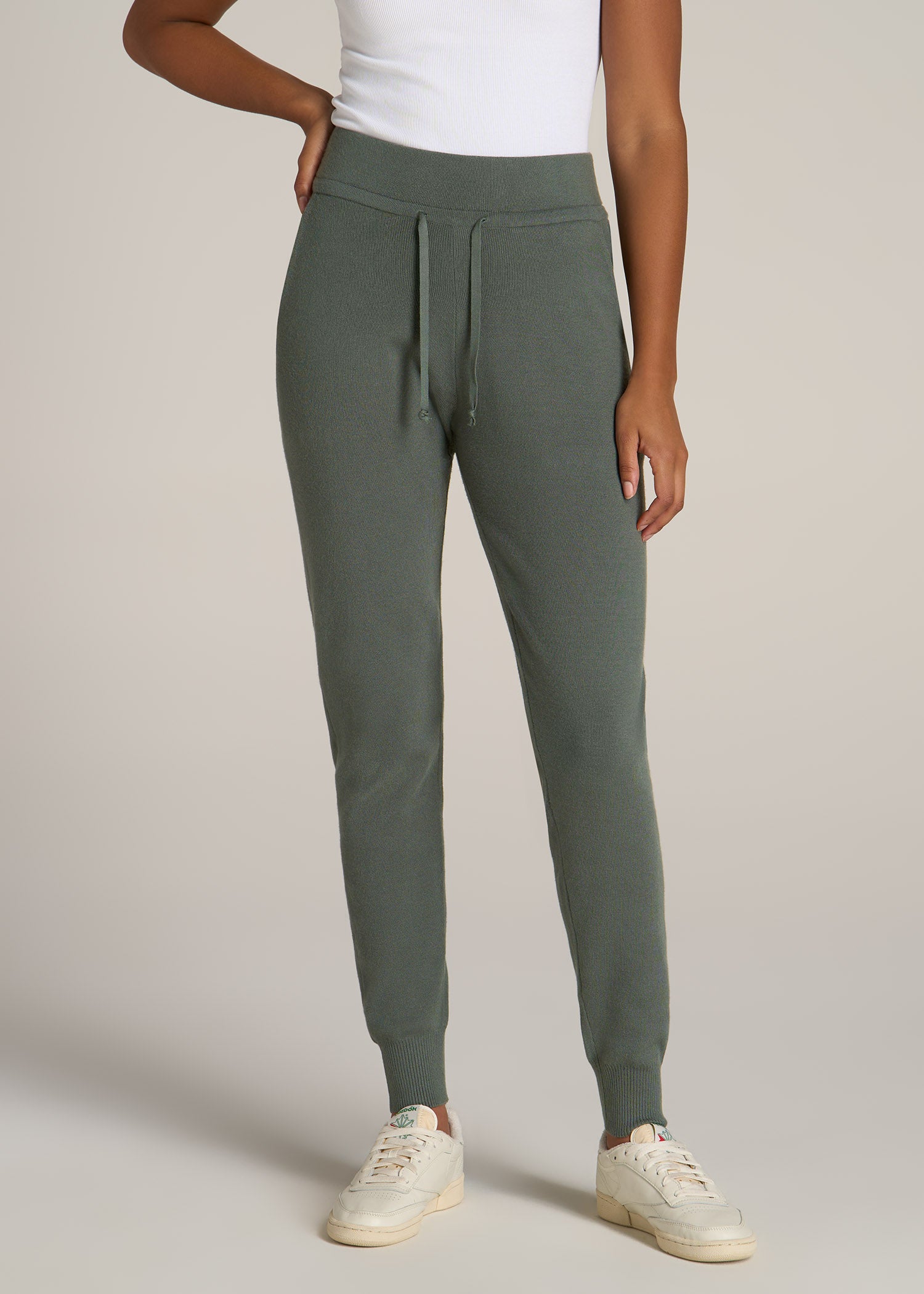A tall woman wearing American Tall's Women's Tall Knit Lounge Jogger in the color Malachite Green.