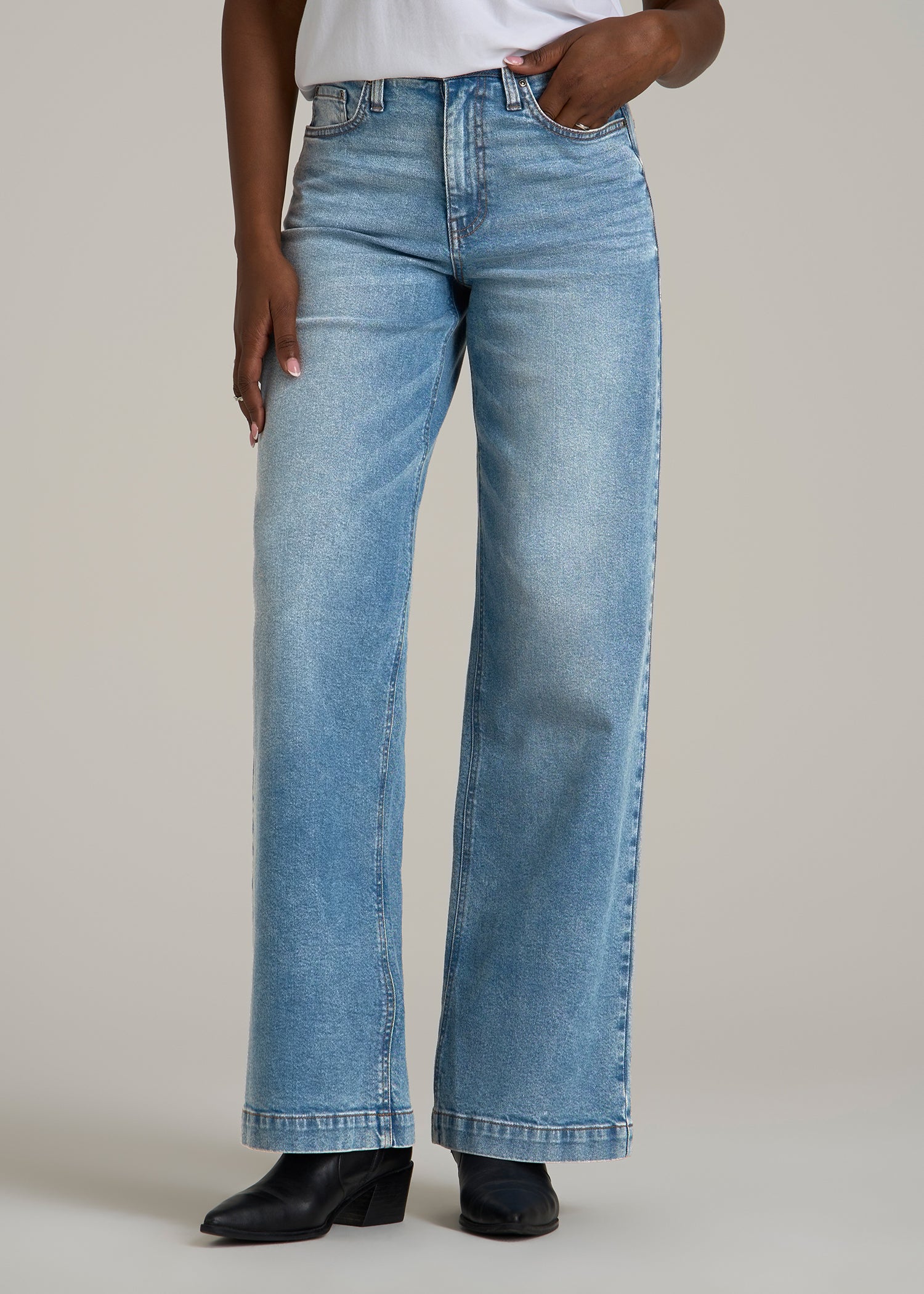 A tall woman wearing American Tall's Luna High-Rise Wide-Leg Jeans for Tall Women