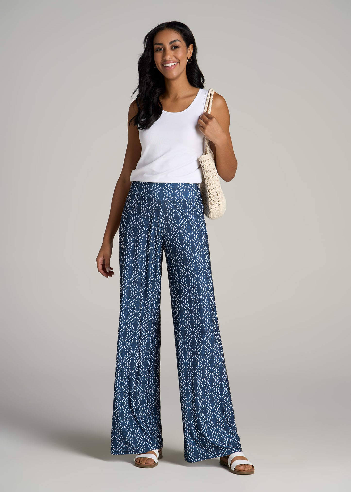 A tall woman wearing Pull On Breezy Wide Leg Pants for Tall Women in Indigo Tribal Print from American Tall