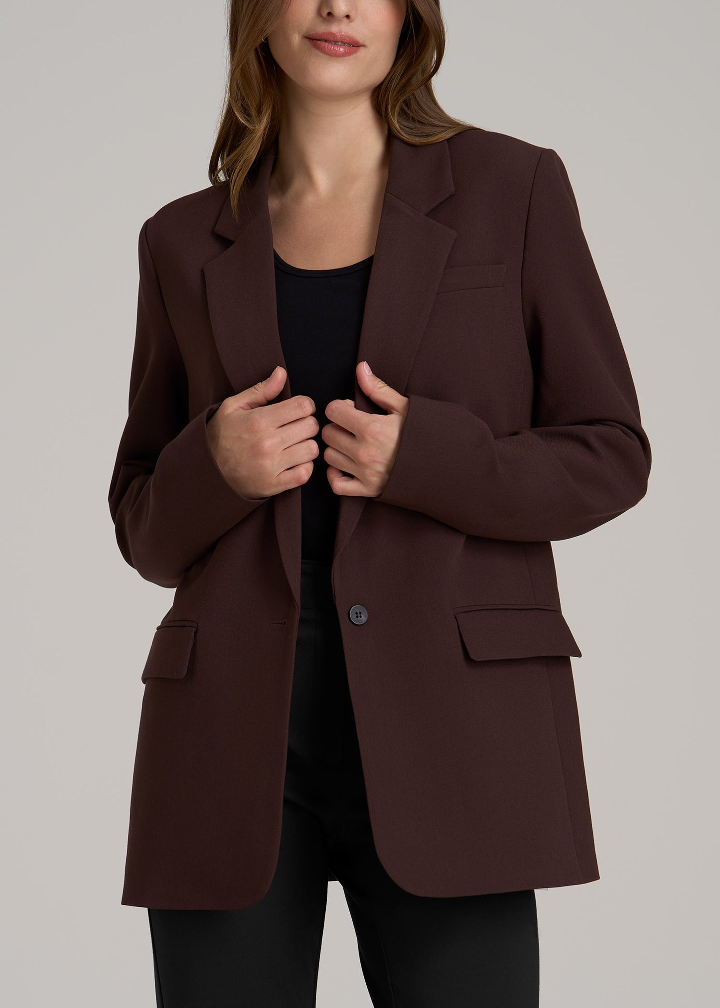 A tall woman wearing American Tall's Relaxed Single-Button Tall Blazer for Women in Chestnut