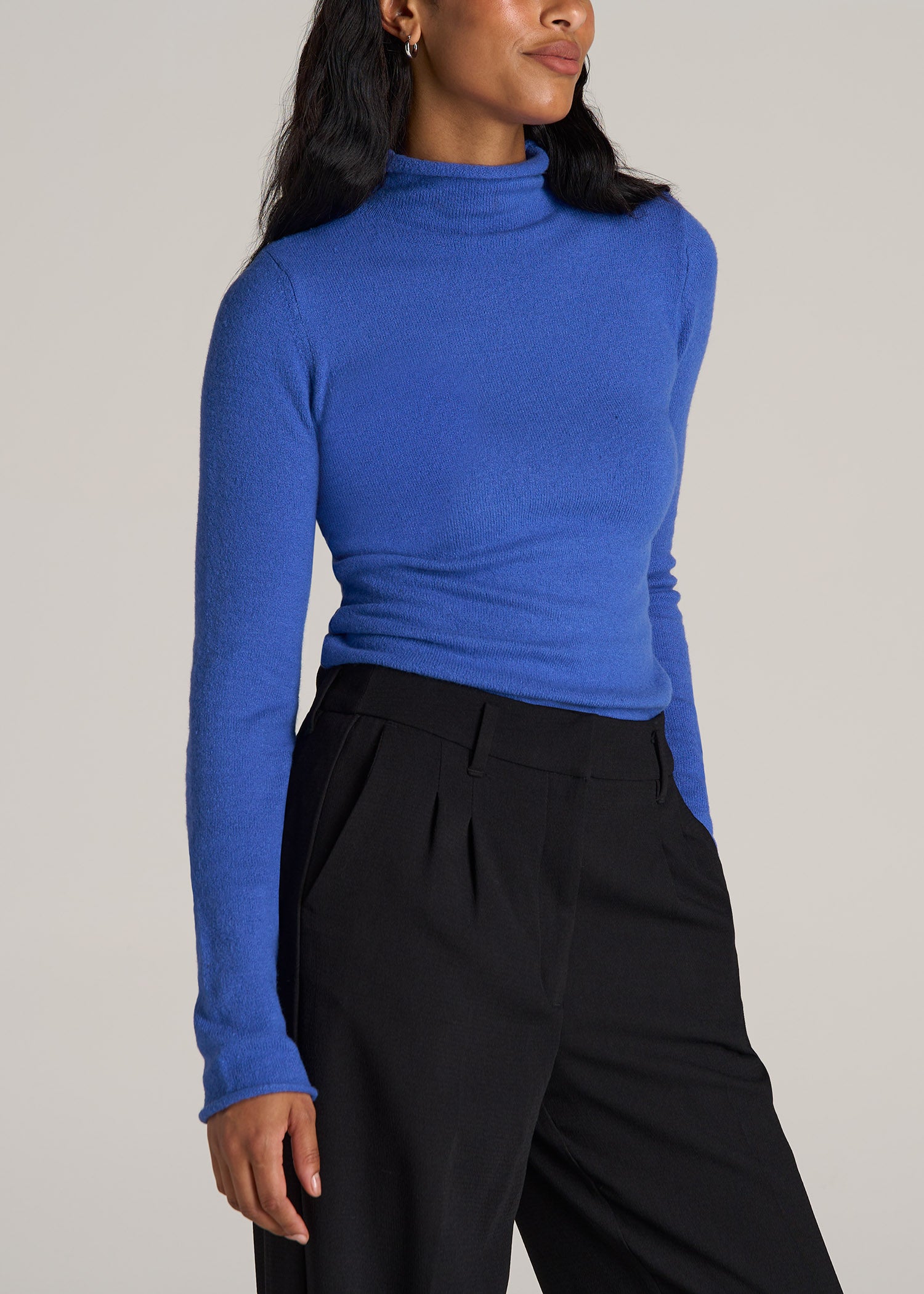 Tall woman wearing American Tall's Women's Tall Rolled Mock Neck Sweater in Light Cobalt.