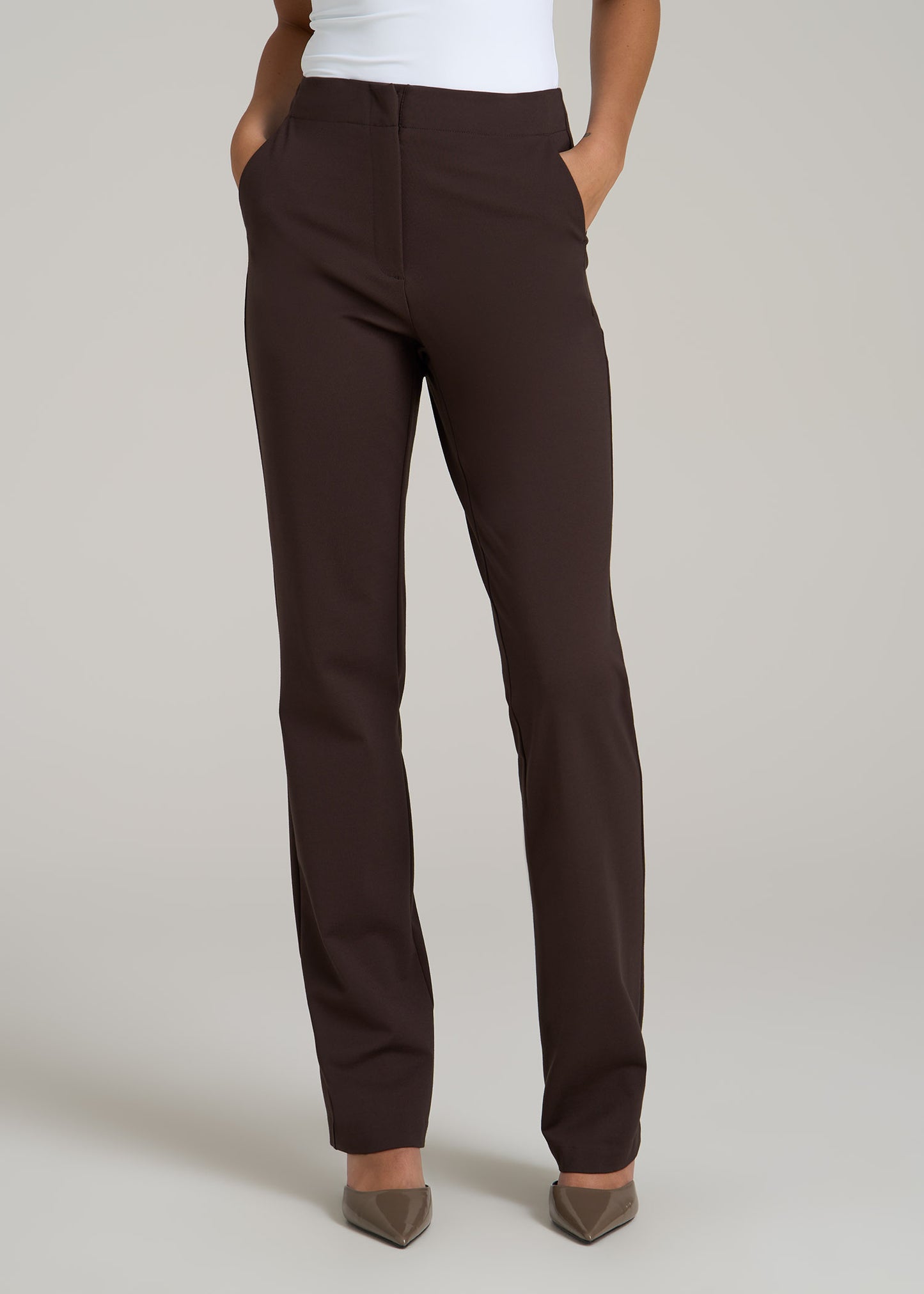 A tall woman wearing American Tall's Slim Straight Leg Dress Pants for Tall Women in Espresso