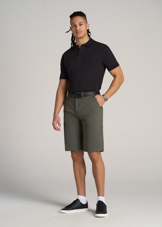 A tall man wearing American Tall's Classic Polo with Embroidered Logo in the color Black.