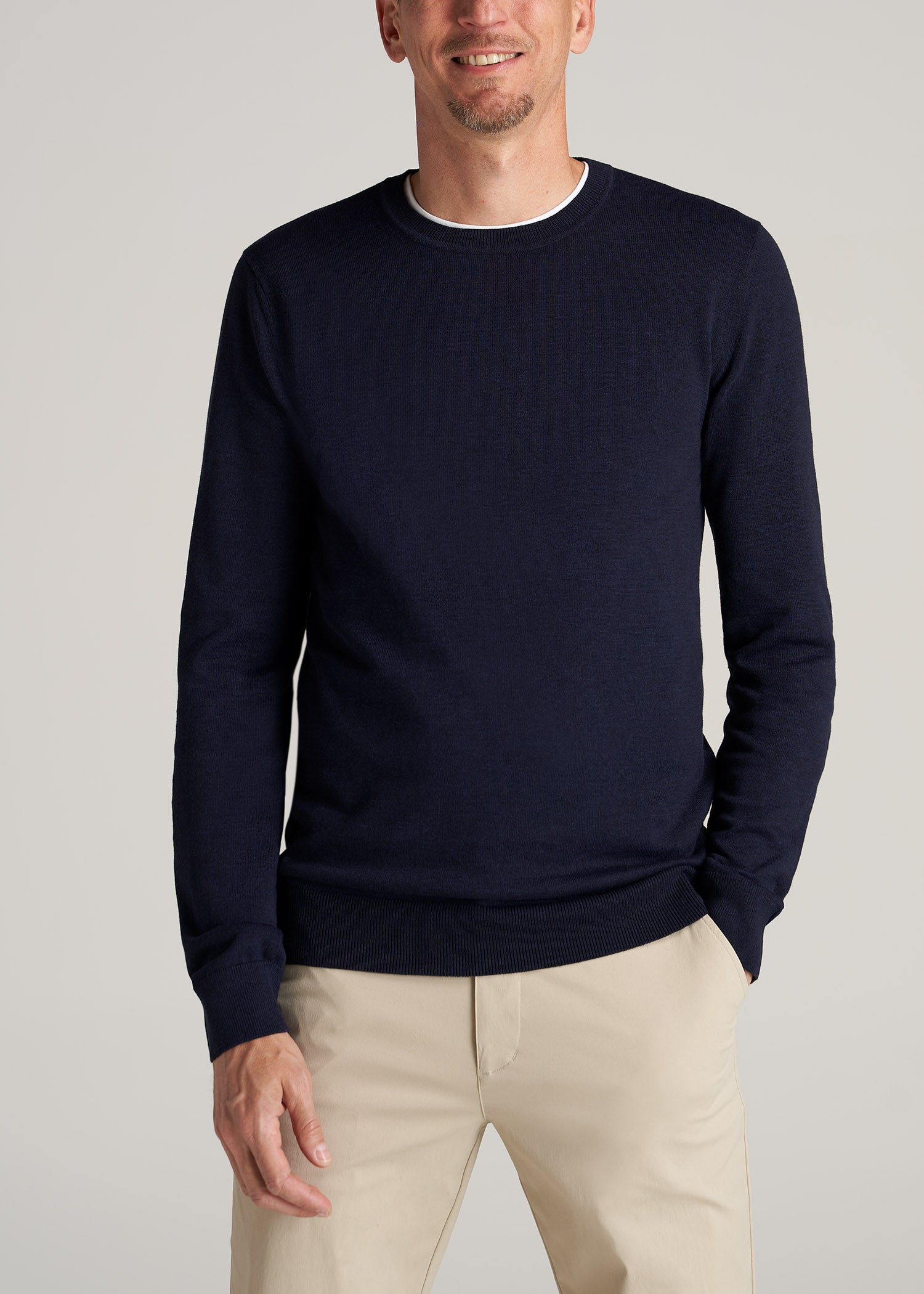 Tall guy wearing American Tall's Everyday Crewneck Sweater in the color Patriot Blue.