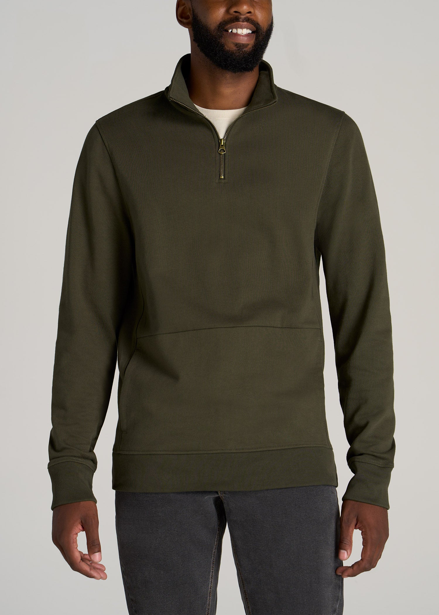 Semi-tall man wearing American Tall's LJ&S Heavyweight Quarter-Zip Pullover in the color Vintage Thyme Green.