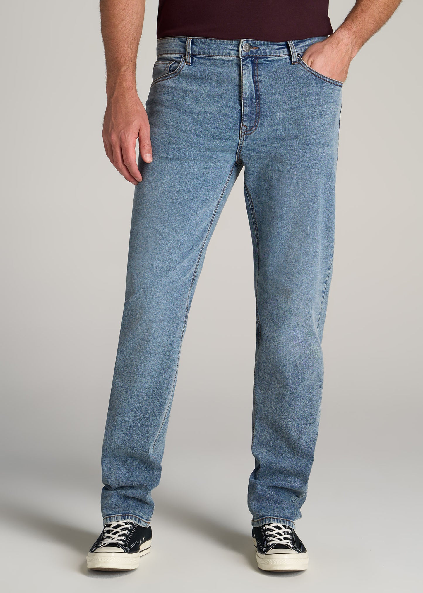 Tall man wearing J1 Straight Leg Jeans in Vintage Faded Blue by American Tall