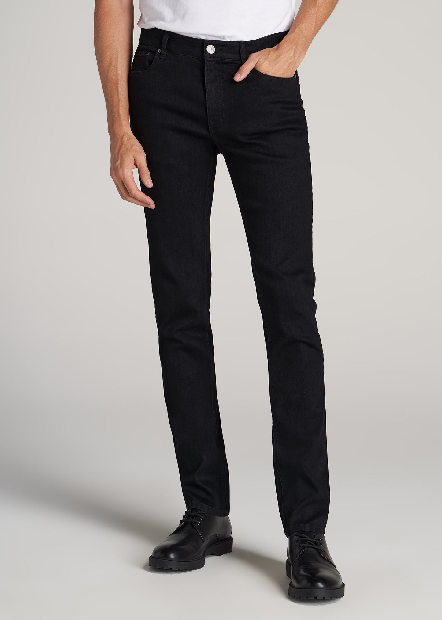 Tall guy wearing American Tall's Dylan Slim-Fit Jeans in the color Black.