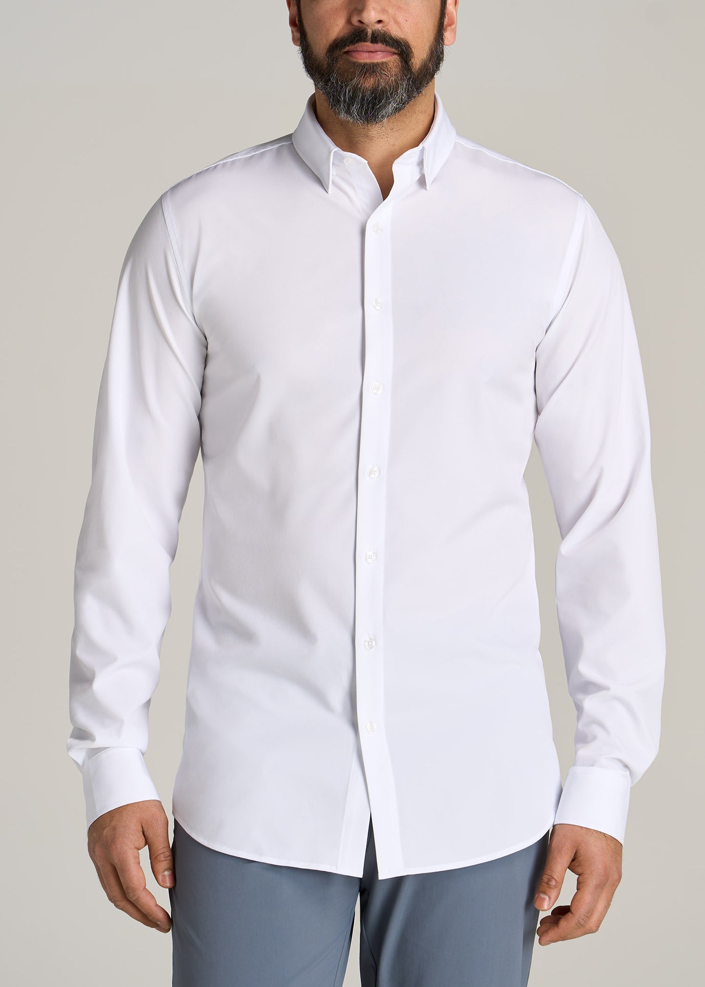 Tall guy wearing American Tall's Traveler Stretch Dress Shirt in the color White.