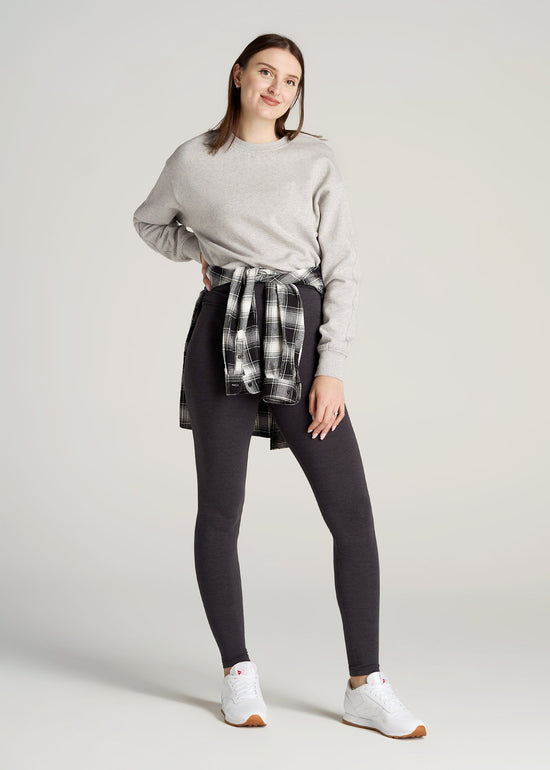 A tall woman wearing American Tall's Cotton Leggings in the color Shadow Grey Mix.