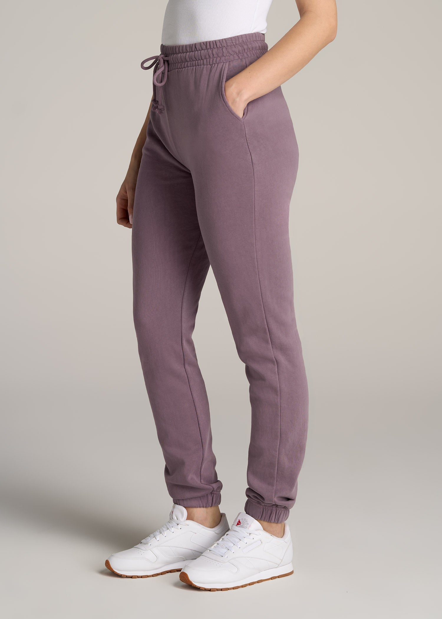 https://americantall.com/cdn/shop/products/American-Tall-Women-Wearever-SLIM-High-Waisted-Garment-Dye-Sweatpants-Smoked-Mauve-side_1946x.jpg?v=1668783704